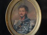 portrait of a man in a military uniform in a gold frame