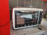 a toaster oven sitting on top of a counter in a kitchen