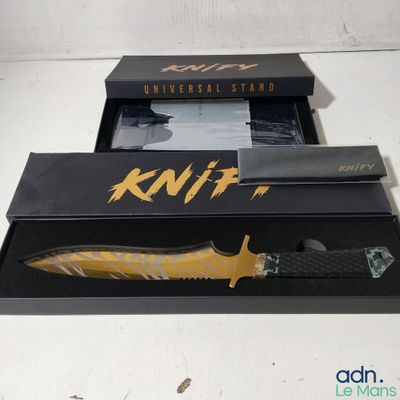 a knife that is in a box on a table