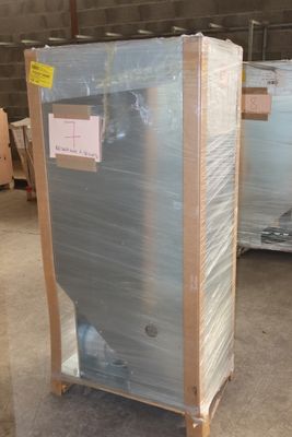 a large refrigerator in the middle of a pallet in a warehouse