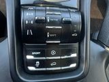 a close up of a cell phone in a car ' s dashboard