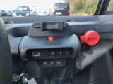 a car dashboard with a remote control in it