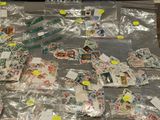 a lot of stamps and postcards on a table