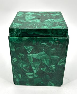 an image of a green box sitting on top of a white surface