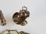 a silver plate with a spoon and spoon rest on top of it