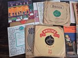 a lot of records that are on a table