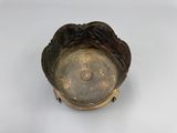a small metal object that is on a white surface