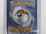 a close up of a pokemon trading card in a plastic case
