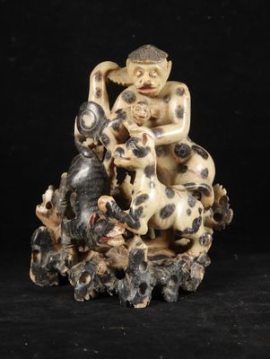 chinese carved ivory figurine of a man with dogs and cats