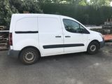 a white van that is parked in the parking lot