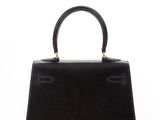 a black handbag on a white background
