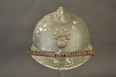 a helmet on a stand with a rope around it