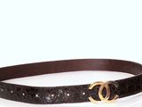 a picture of a black belt with a gold buckle