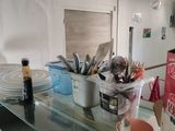 a glass table with a bunch of utensils on it