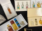 a lot of different perfume bottles in a box