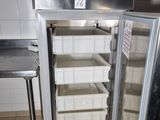 an image of a stainless steel refrigerator in a kitchen