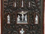 an old wooden plaque with a picture of jesus on the cross and other religious figures