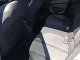 the back seats of a car are empty in the parking lot