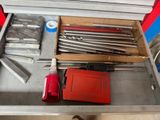 a tool box with tools in it sitting on a table