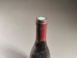 a bottle of wine that is sitting on a table