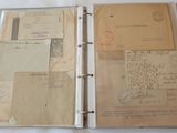 a binder with a lot of old letters on it