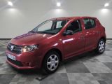 a picture of a red car parked on a checkered floor