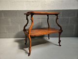 a small table with a shelf on top of it
