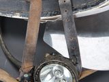 a helmet with a light on top of it on a table