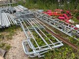 a lot of metal pipes and pipes laying on the ground