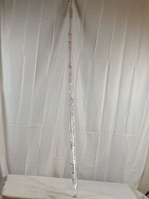 a white toilet sitting in a bathroom next to a white curtain