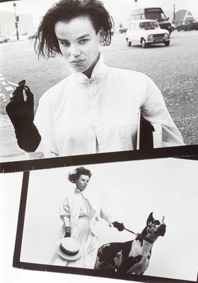 a black and white photo of a woman riding a horse