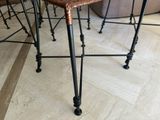 a table that has a bunch of chairs on it