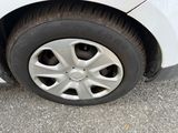 a close up of a car ' s tire on the pavement