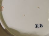 a close up of a plate with the letter f e on it
