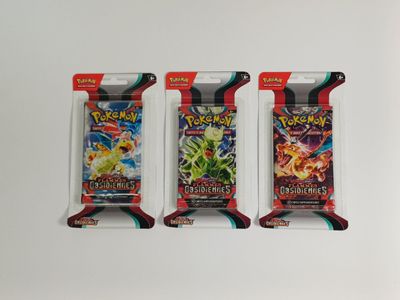 trois paquets de cartes à collectionner Pokémon