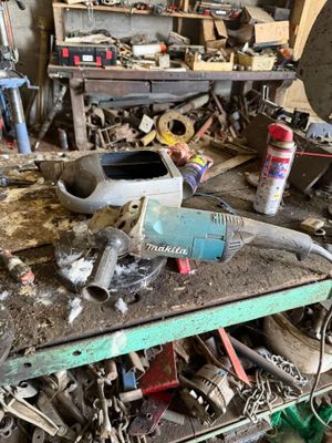 a workbench with tools on it in a garage
