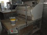 a machine that is sitting on a table in a kitchen