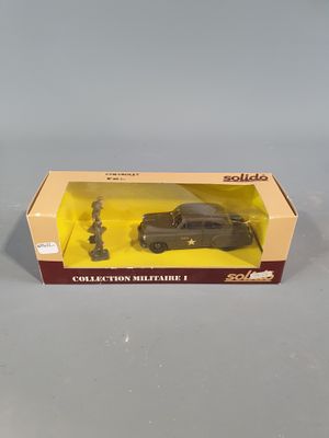 a box with a toy car in it sitting on a table