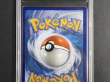 a close up of a pokemon card in a plastic case
