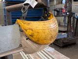 a banana hanging from the side of a machine