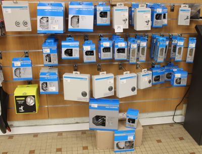 many boxes of electronics on the wall in the store