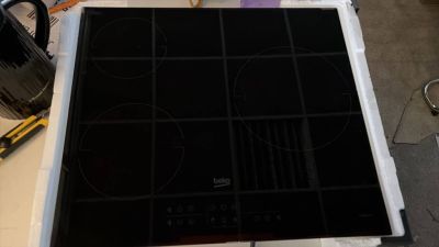 an image of a stove top with a black burner on top of it