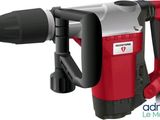 a close up of a red and black demolition hammer on a white background