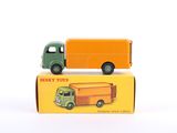 two toy trucks sitting next to each other on top of a box