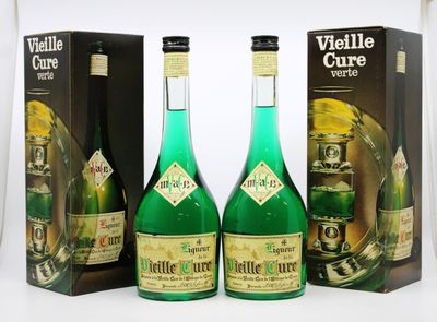 three bottles of green wine sitting next to each other on a table