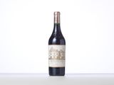 the bottle of wine is sitting on the table with a white background