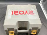 a plastic tool box with a yellow handle on a black surface