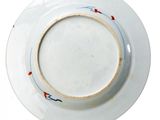 a white plate with a red and blue design on it