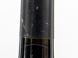 three bottles of wine that are sitting on a table