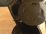 a coffee maker that is sitting on top of a wooden table